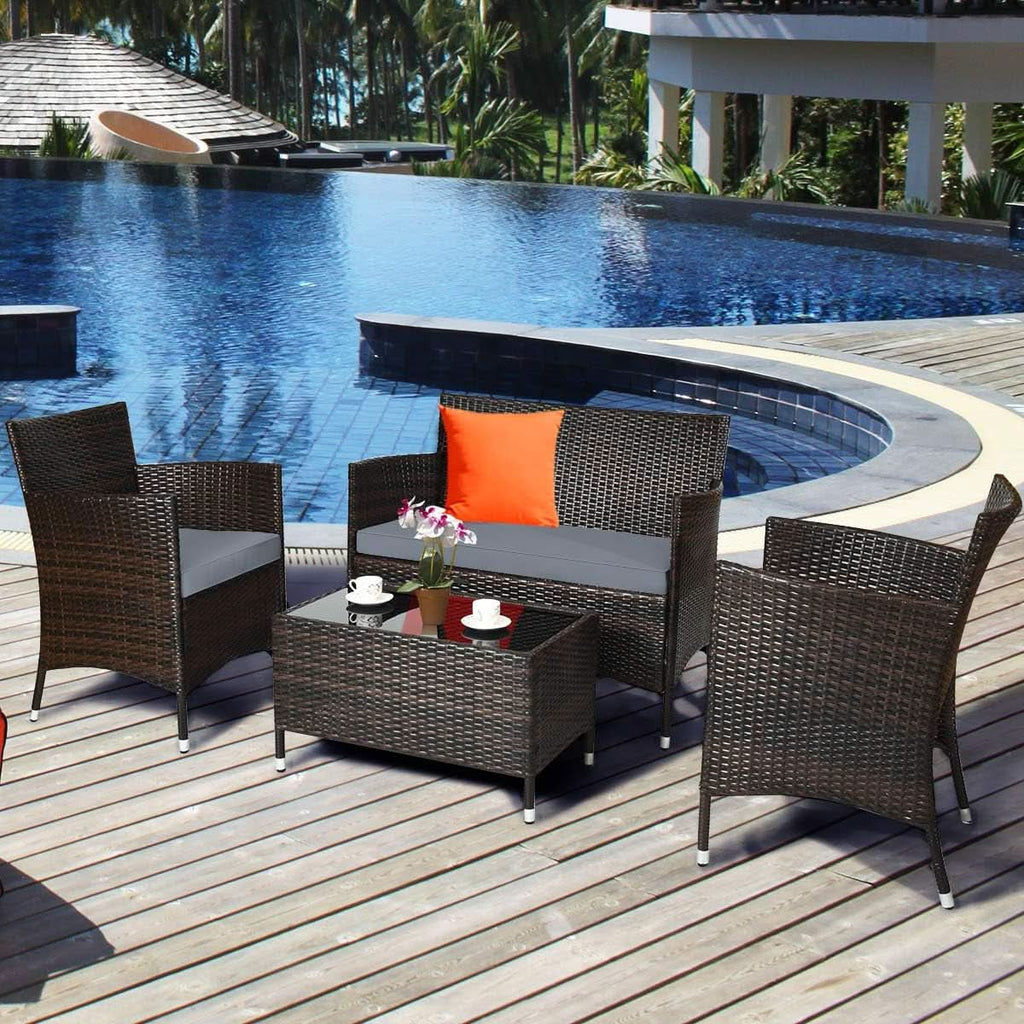 Elegant Four-Piece Rattan Patio Set with Soft Cushions